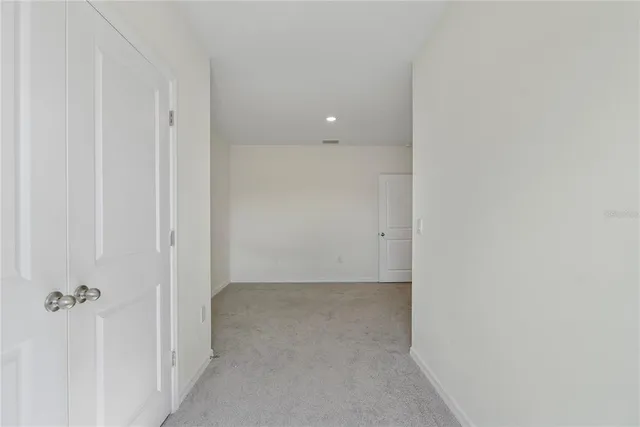 a view of a hallway with windows