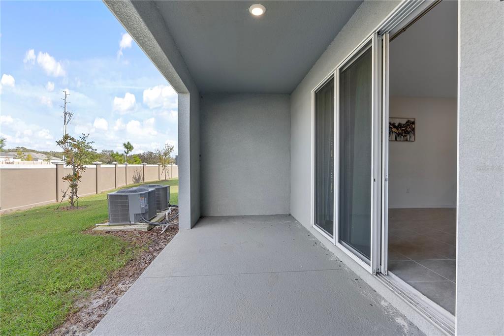 32395 Turtle Grace Loop Wesley Chapel, FL 33545 - Photo 24 of 39 a view of a house with a outdoor space