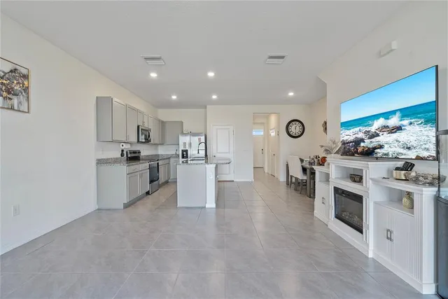 a large kitchen with cabinets and stainless steel appliances