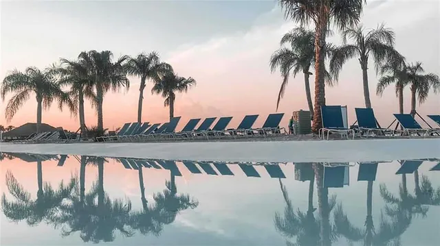 swimming pool view with a outdoor seating