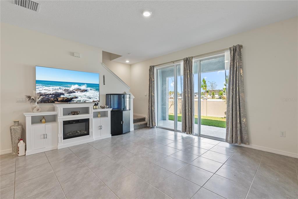 32395 Turtle Grace Loop Wesley Chapel, FL 33545 - Photo 6 of 39 a kitchen with stainless steel appliances a stove and a refrigerator