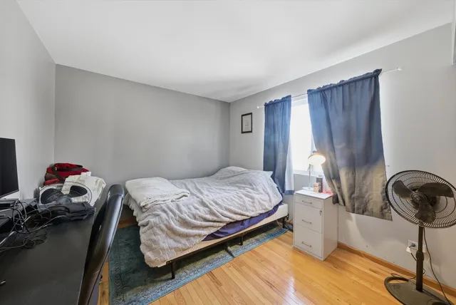 a bedroom with a bed and cabinets