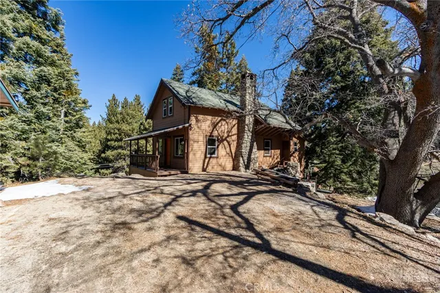 a front view of a house with trees