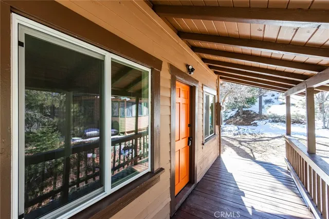 a view of a house with a large tree