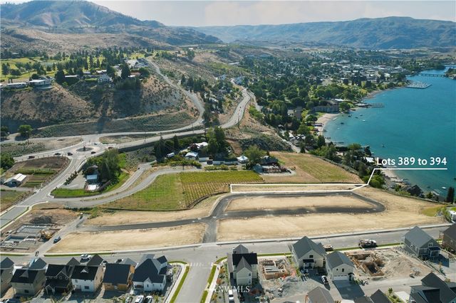 a view of a swimming pool with a yard and mountain view