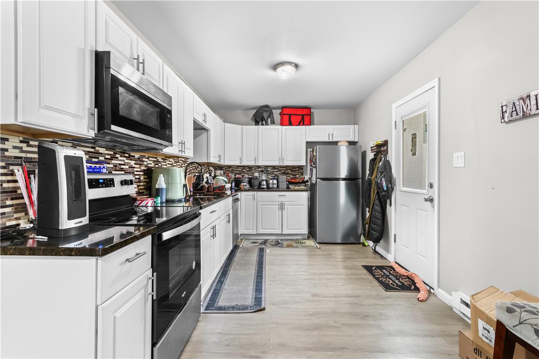 12 South Front Street Coplay, PA 18037 - Photo 10 of 41 This bright kitchen features sleek appliances and ample storage, perfect for any home chef.