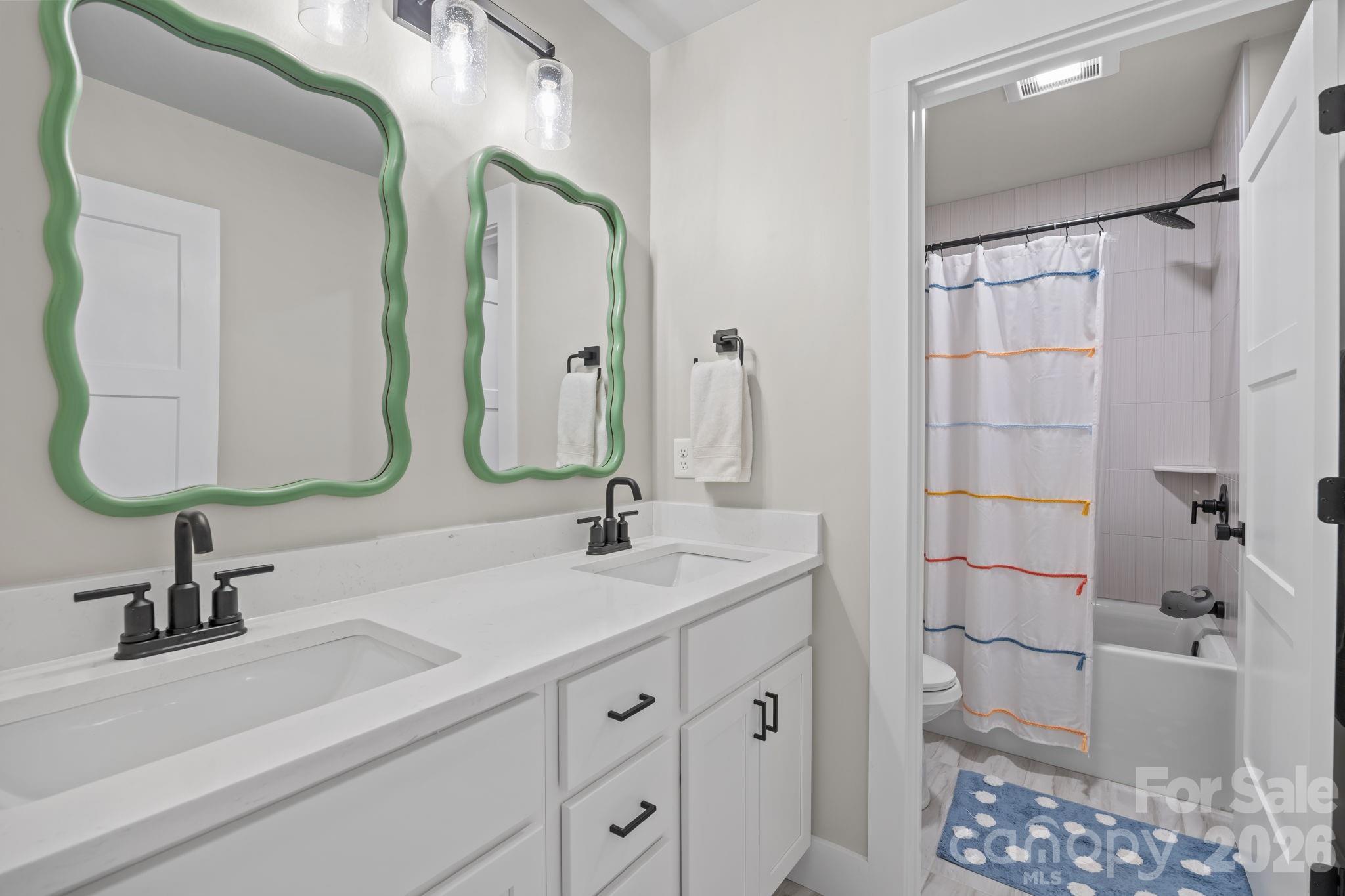 234 Gravely Branch Road Fletcher, NC 28732 - Photo 26 of 46 a bathroom with a double vanity sink mirror and bathtub