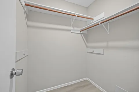 a bathroom with a bath tub with a shower