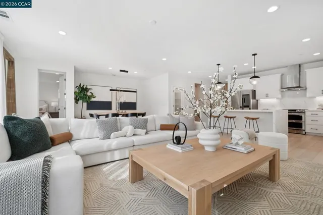 a living room with furniture and a table