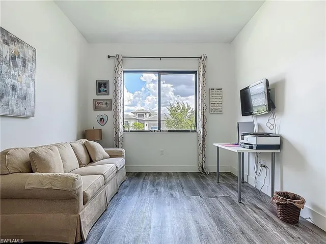 a view of a workspace with furniture