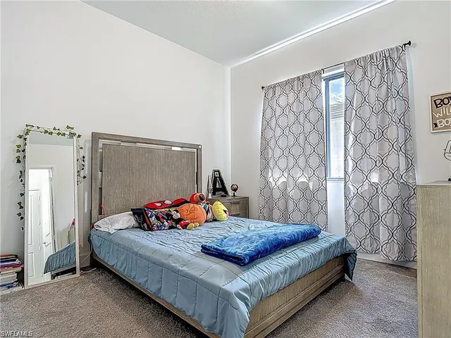 a bedroom with a bed and a cabinets