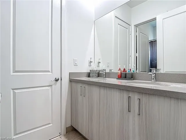 a white toilet sitting next to a shower curtain