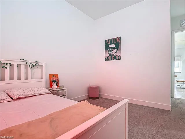 a room with a bed and a window