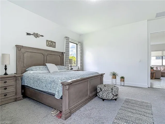 a living room with furniture and flat screen tv