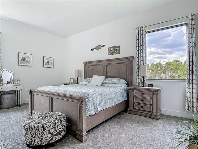 a bathroom with a granite countertop sink a mirror and a shower