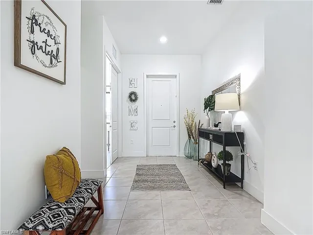 a view of room with furniture and wooden floor
