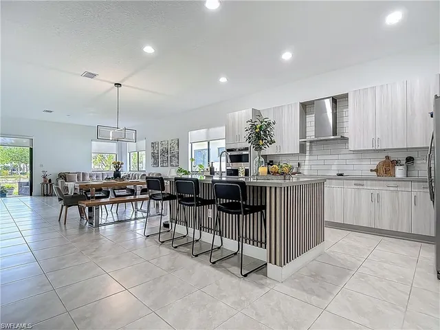 a kitchen with lots of counter top space and dining table