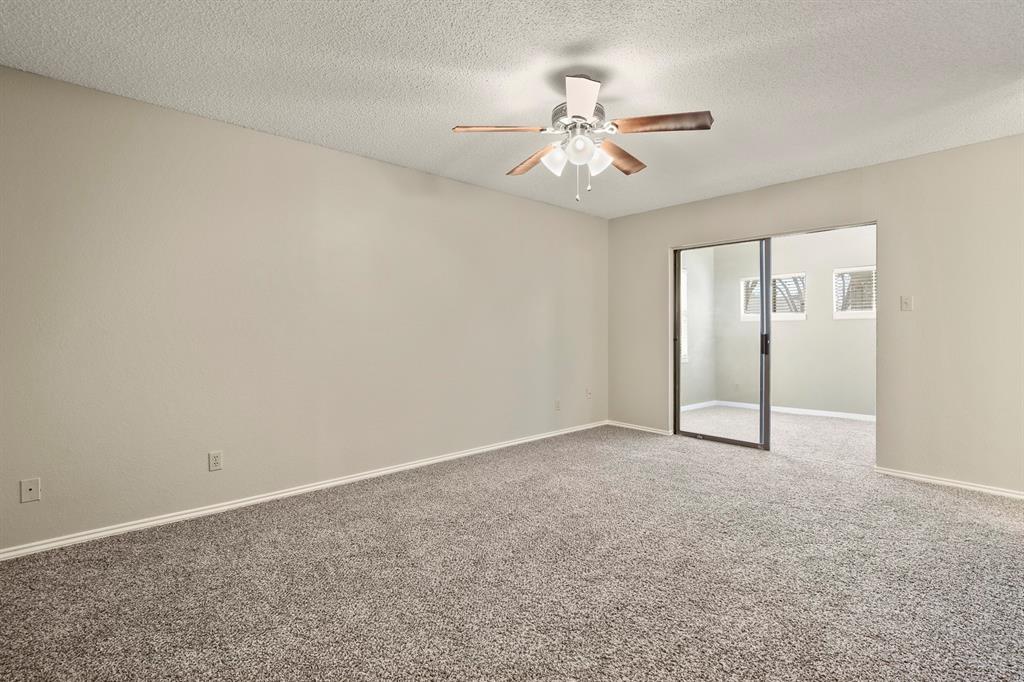 1916 Everglade Court Grapevine, TX 76051 - Photo 20 of 35 a view of an empty room with a chandelier fan