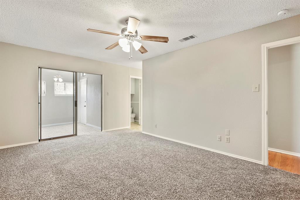 1916 Everglade Court Grapevine, TX 76051 - Photo 21 of 35 a view of an empty room with a fan