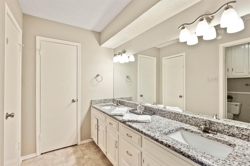 1916 Everglade Court Grapevine, TX 76051 - Photo 23 of 35 a bathroom with a sink and a mirror