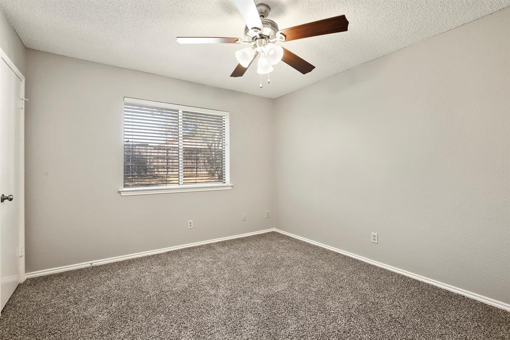 1916 Everglade Court Grapevine, TX 76051 - Photo 31 of 35 an empty room with windows and fan
