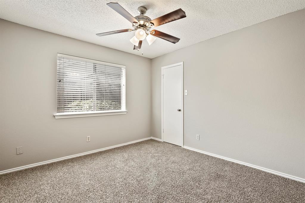 1916 Everglade Court Grapevine, TX 76051 - Photo 32 of 35 an empty room with windows and fan