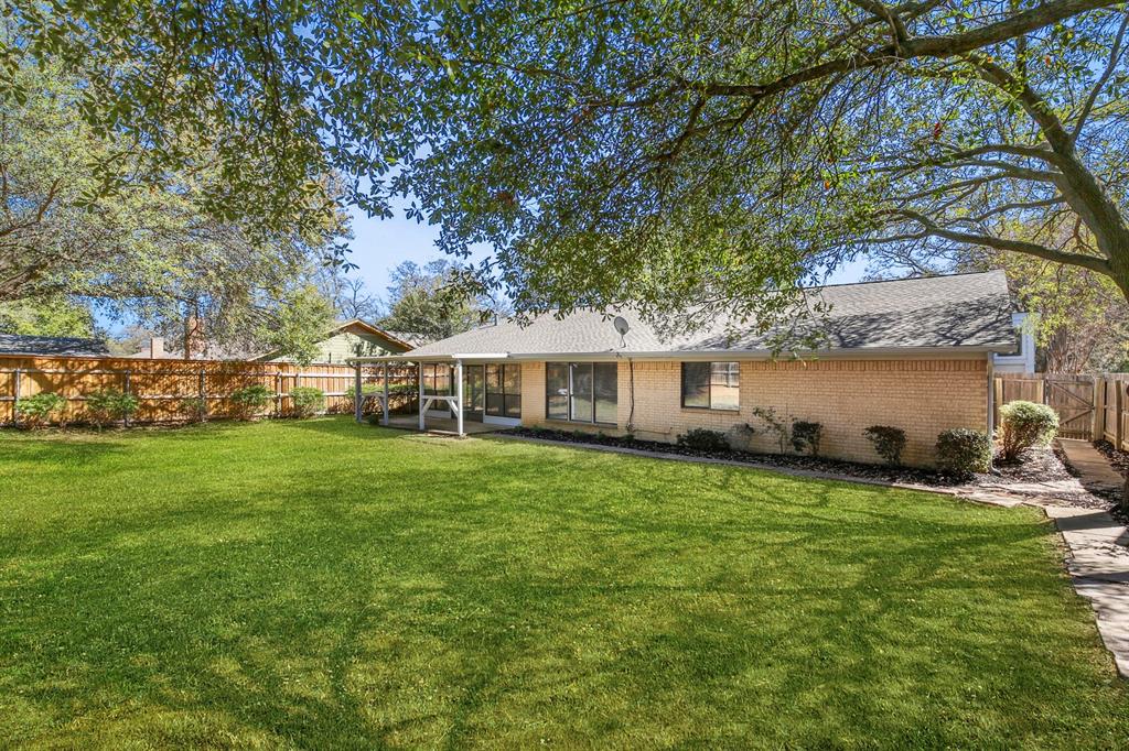 1916 Everglade Court Grapevine, TX 76051 - Photo 34 of 35 a front view of a house with garden