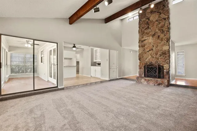 a kitchen with stainless steel appliances granite countertop a stove oven and a refrigerator with white cabinets