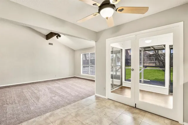 a kitchen with stainless steel appliances granite countertop grey cabinets a stove a sink and dishwasher