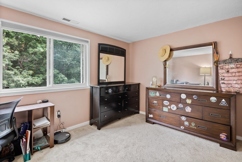 189 Littleton Road, Unit 44 Chelmsford, MA 01824 - Photo 13 of 20 a bedroom with a bed and a dresser