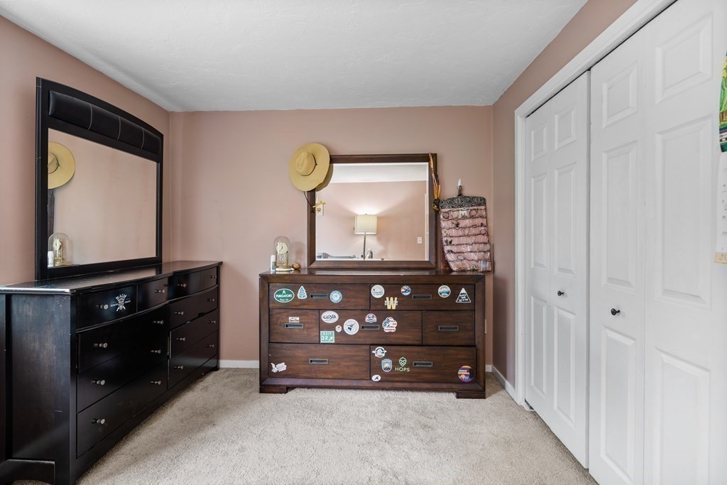 189 Littleton Road, Unit 44 Chelmsford, MA 01824 - Photo 14 of 20 a room with furniture and flat screen tv