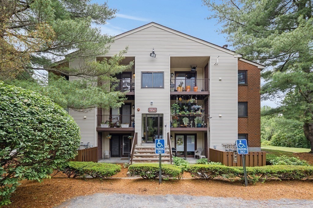 189 Littleton Road, Unit 44 Chelmsford, MA 01824 - Photo 16 of 20 front view of a house with a small yard