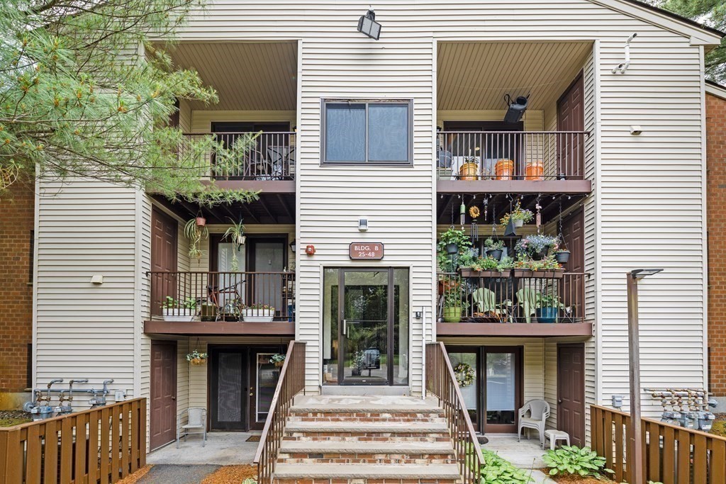 189 Littleton Road, Unit 44 Chelmsford, MA 01824 - Photo 17 of 20 a front view of a house with a balcony