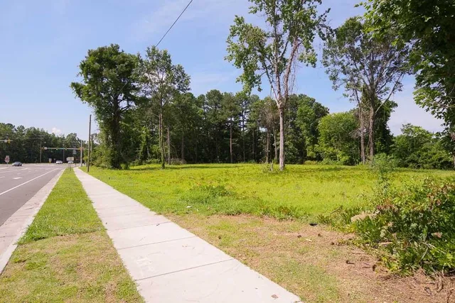 a view of swimming pool with a yard