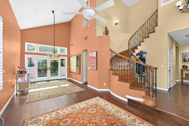 a view of an entryway with wooden floor