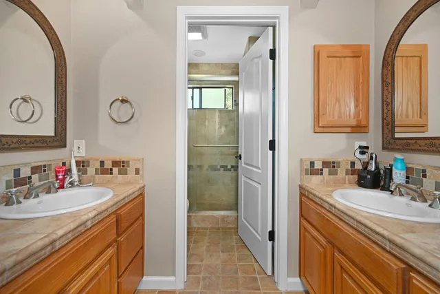 a view of a bathroom sink and mirror