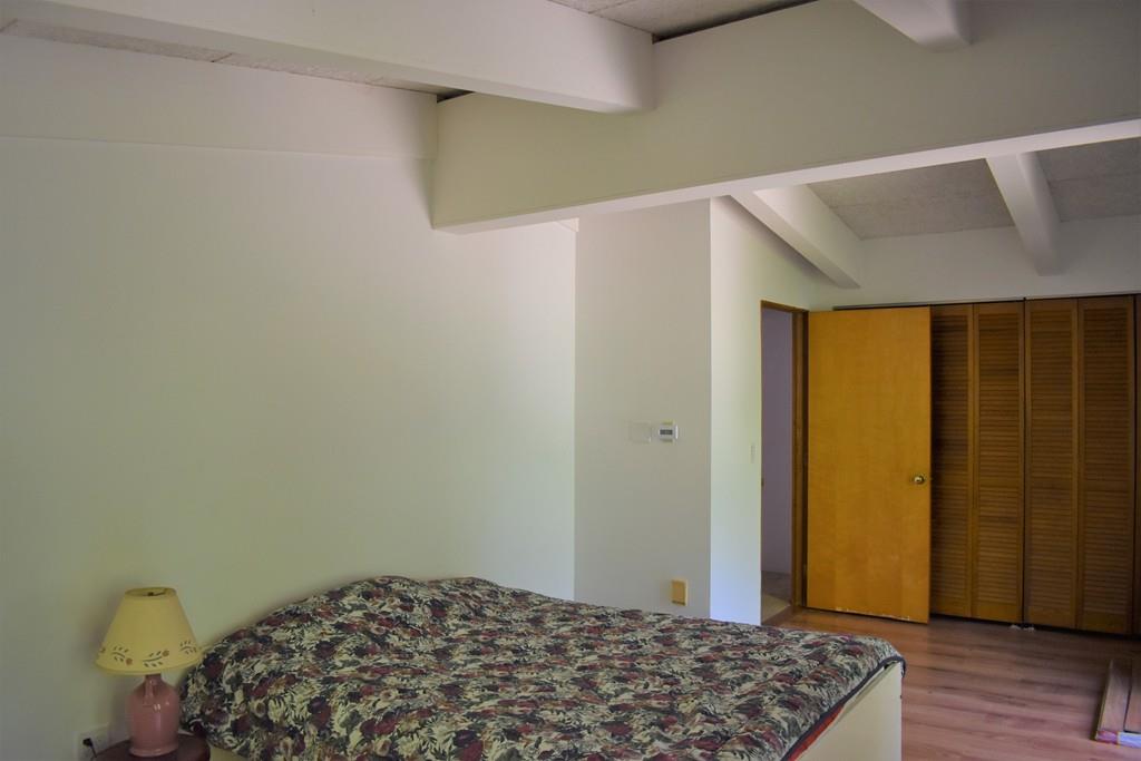 48 Old Stage Road Hatfield, MA 01088 - Photo 8 of 28 a bedroom with a bed and wooden floor