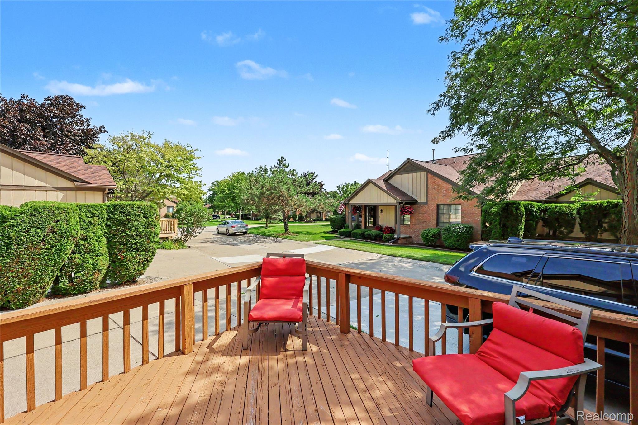 412 Meadow Bridge Drive Rochester, MI 48307 - Photo 19 of 23 Expansive outdoor deck with natural wood finish and sturdy railing