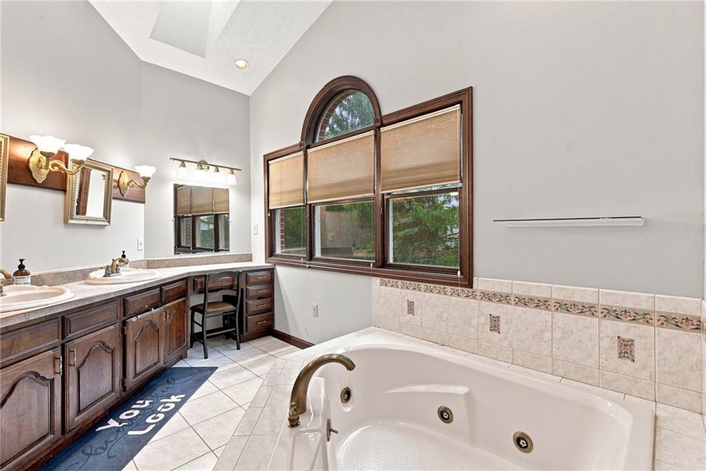 859 Meadowbrook Road Trafford, PA 15085 - Photo 17 of 37 Primary Suite Bathroom with jetted tub and separate shower/water closet