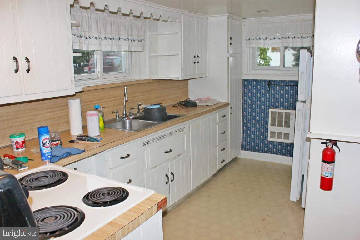 2 Twin Brook Road Lititz, PA 17543 - Photo 5 of 29 a kitchen with a sink a stove and white cabinets