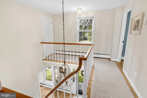 a view of entryway with wooden floor