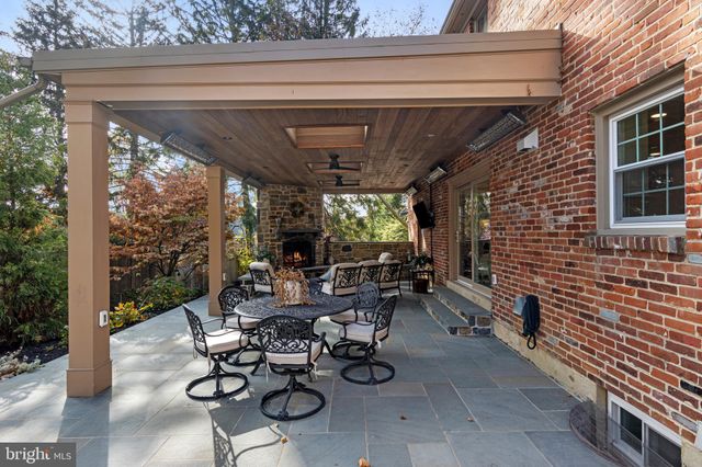 a view of a patio with chairs and table in patio