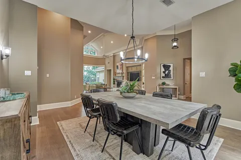 a view of a livingroom with furniture window and wooden floor