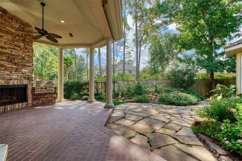 a view of a backyard with garden and patio