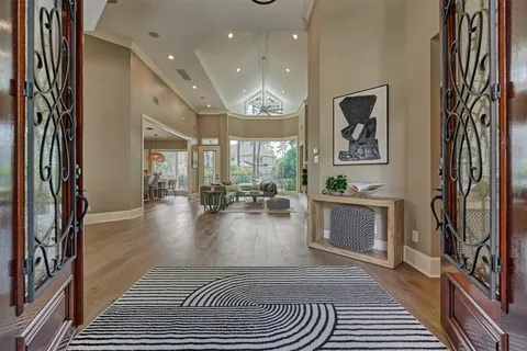 a lobby with furniture and a rug