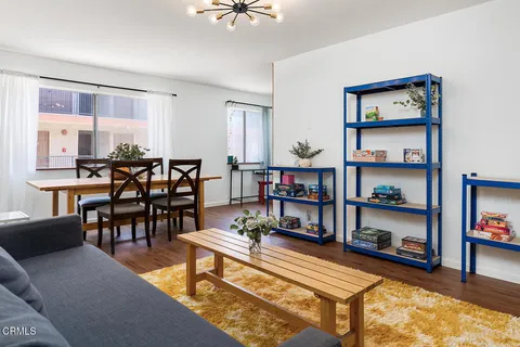 a room with furniture and a book shelf