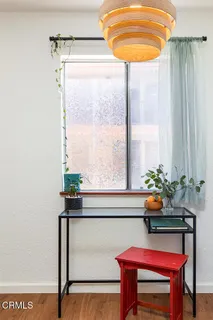 a room with a table and a potted plant