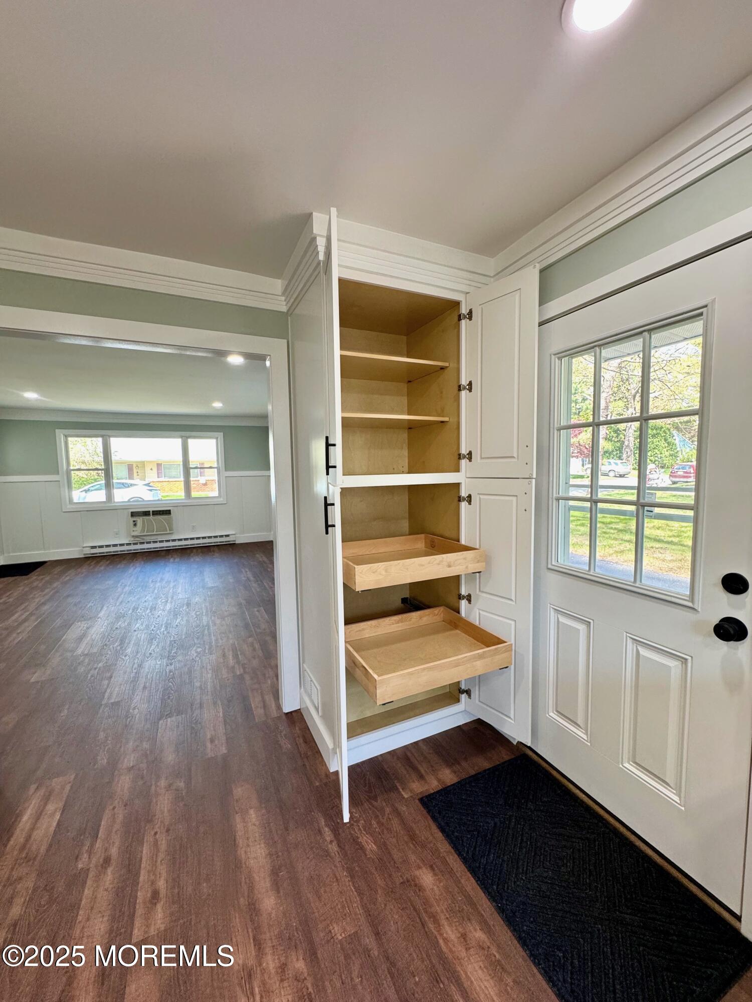 5 Nevada Drive Whiting, NJ 08759 - Photo 18 of 44 a view of an empty room with a window and wooden floor