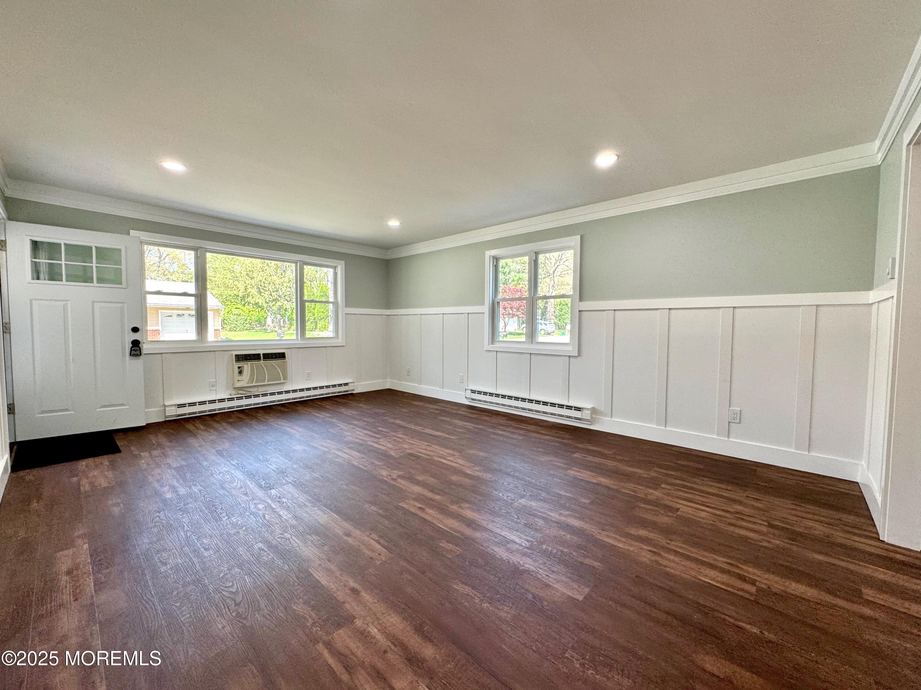 5 Nevada Drive Whiting, NJ 08759 - Photo 22 of 44 an empty room with wooden floor and windows
