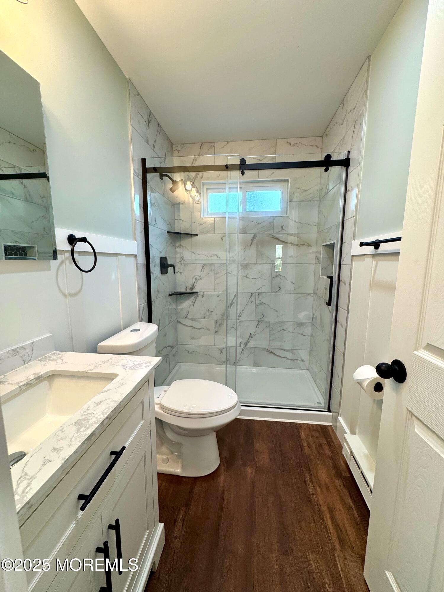 5 Nevada Drive Whiting, NJ 08759 - Photo 24 of 44 a bathroom with a granite countertop sink toilet and shower